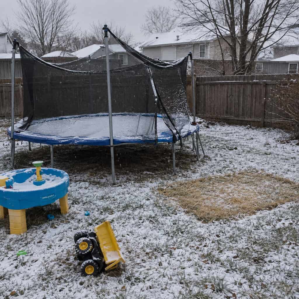Kids' Toys and the Trampoline Still on the Grass